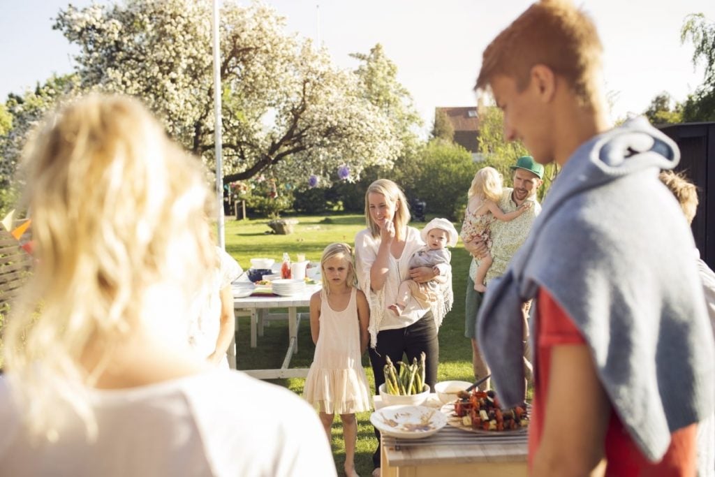 scandinavian people speaking hanging out in garden