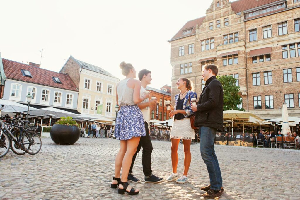 swedish friends talking on street in malmo