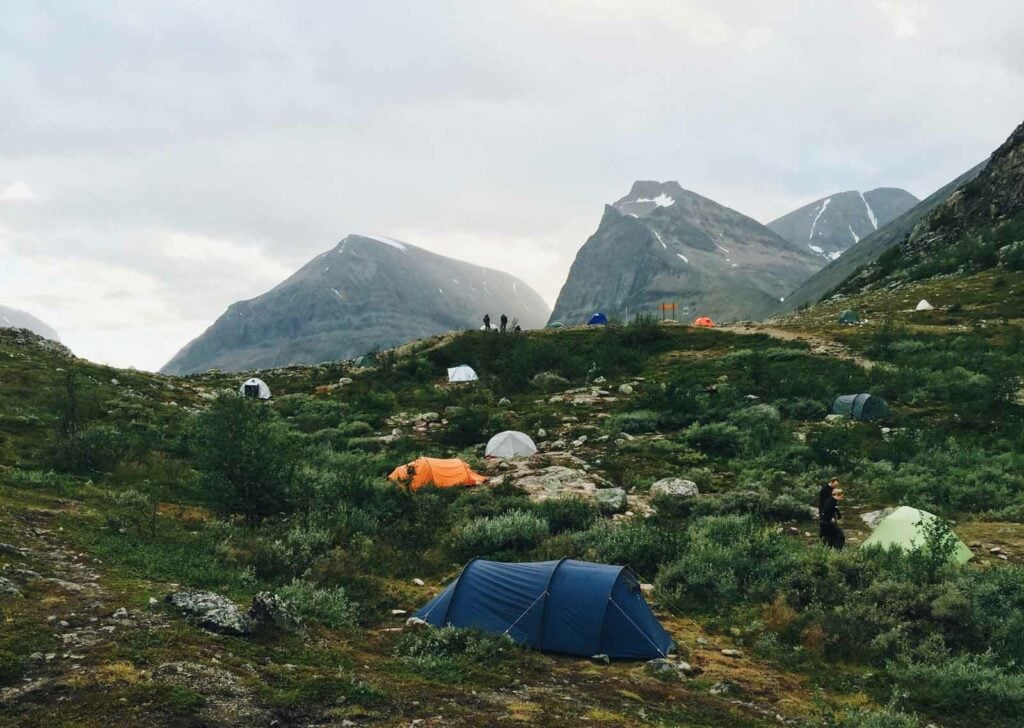 landscape photo of people camping in the swedish mountains